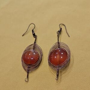 Vintage herringbone wire-wrapped earrings with carnelian or red agate gems.